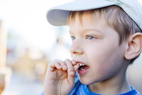 child with loose tooth